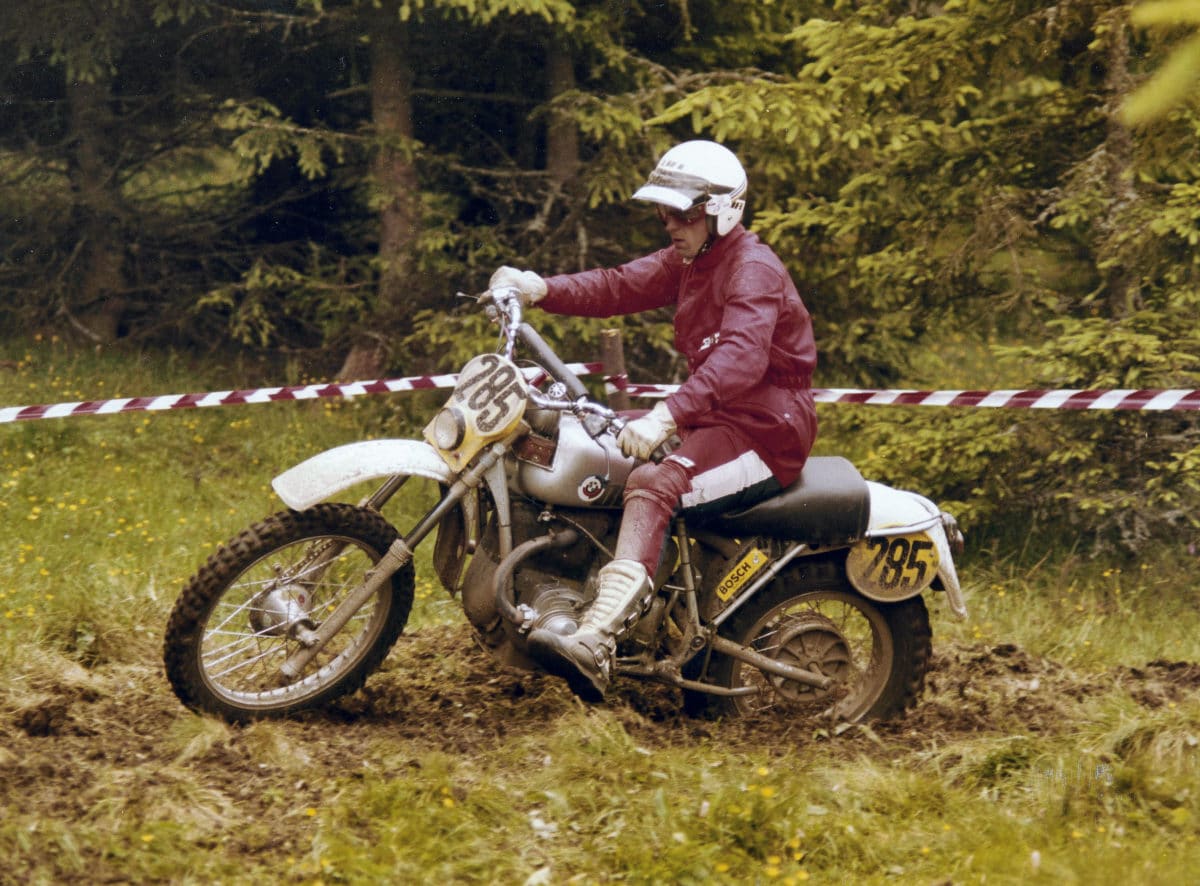 Lazio Perez riding a silver bmw r80 gs motorcycle off road