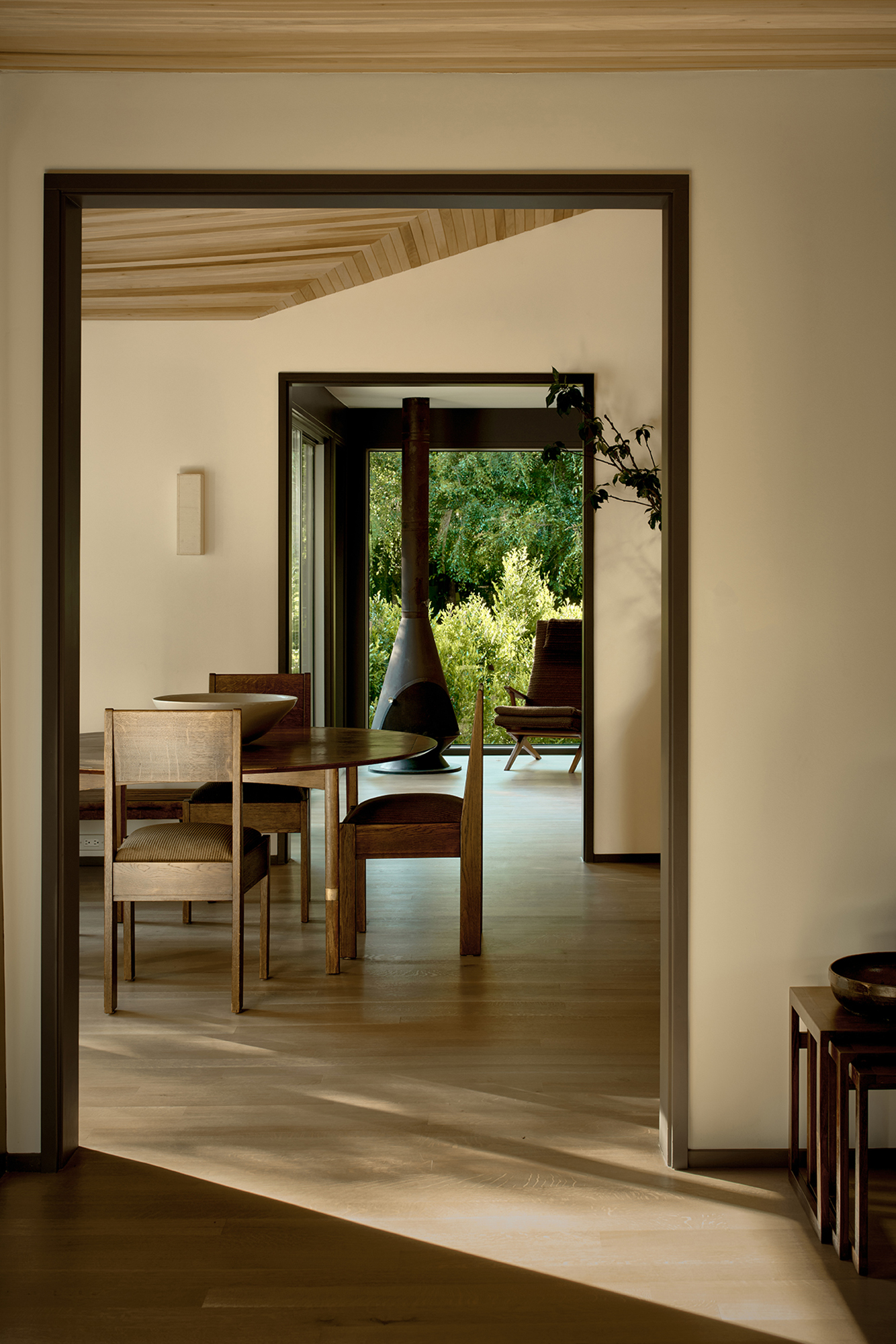 Breland-Harper 05: a wood burning stove is visible behind the dining room.